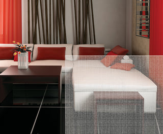 A modern living room scene featuring a white sectional sofa with red and orange accent pillows, a dark wood coffee table, and bold red curtains in the background.